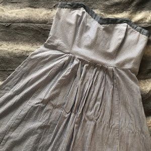 Knee-length, strapless dress.